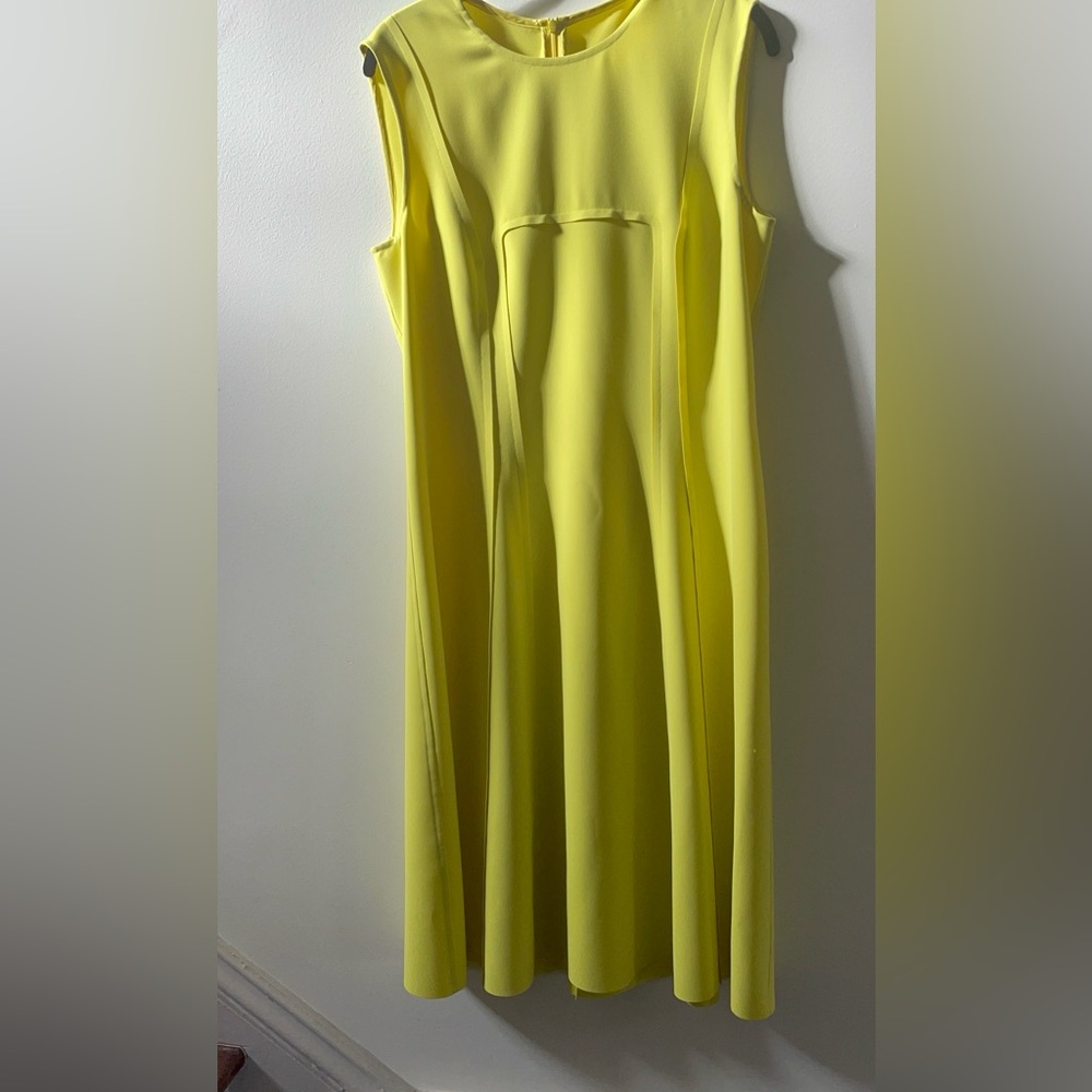 Stylish sheath dress with raw-edge detailing.